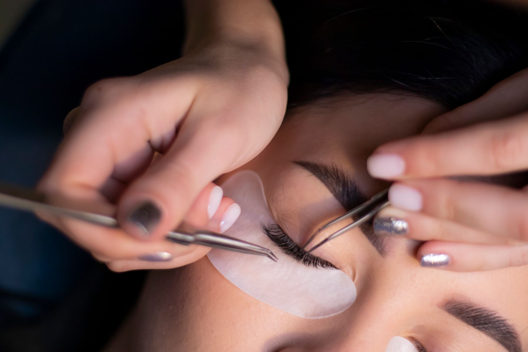 Lash extensions being applied