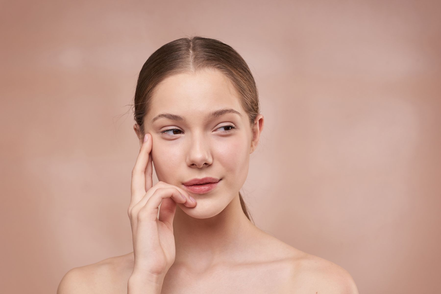 Woman touching her face