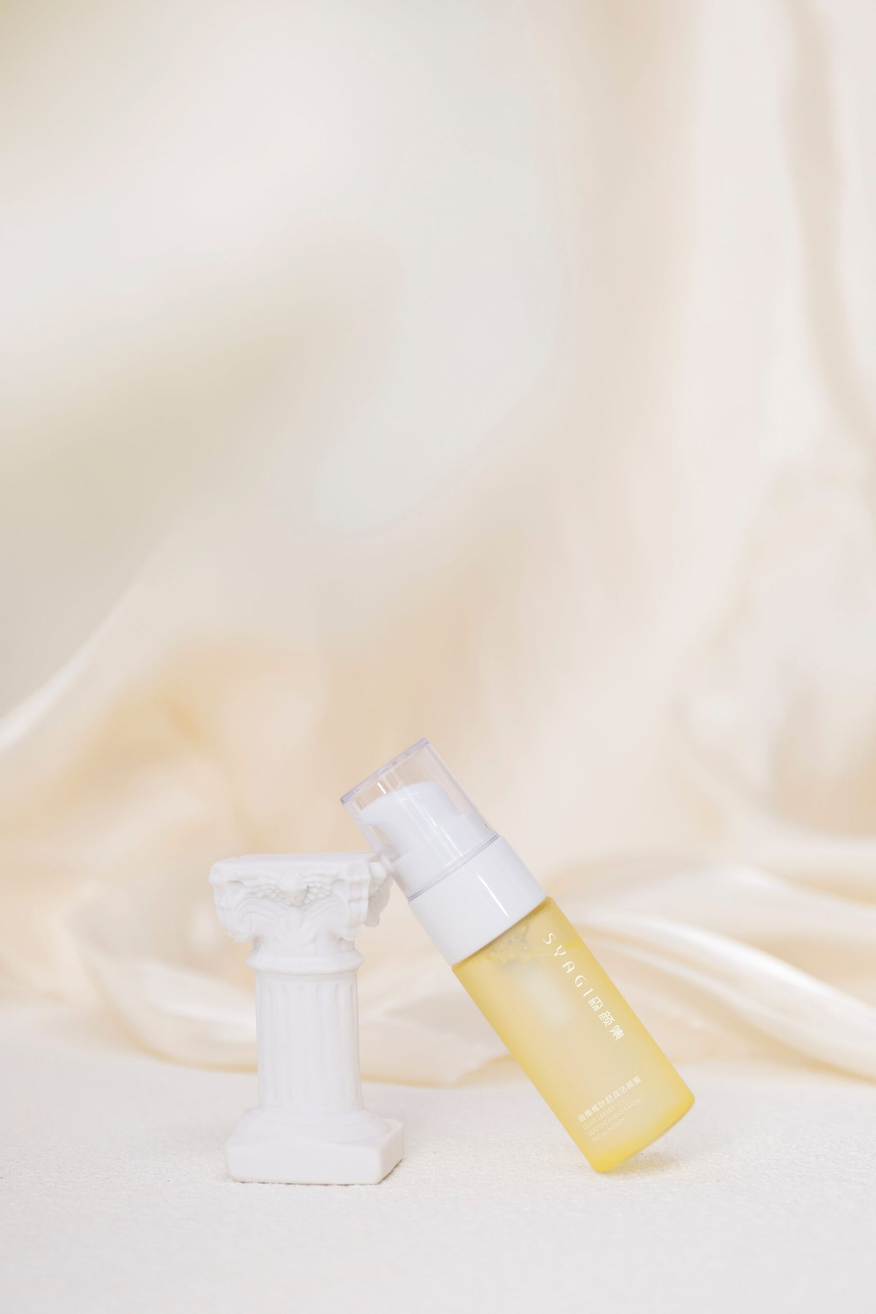 Serum bottle on linen