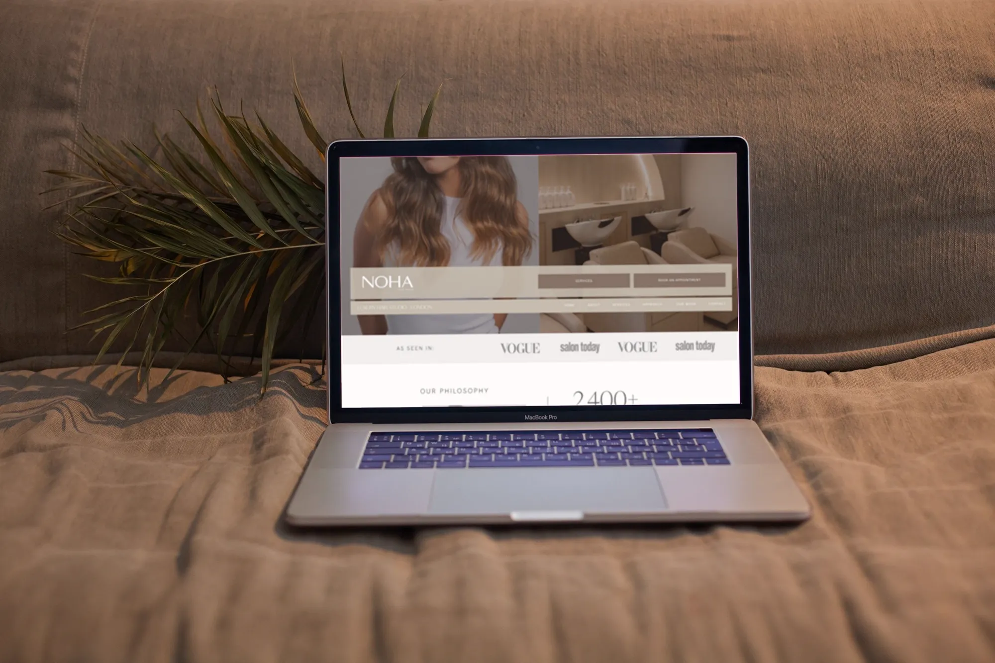 The Noha website template on a laptop