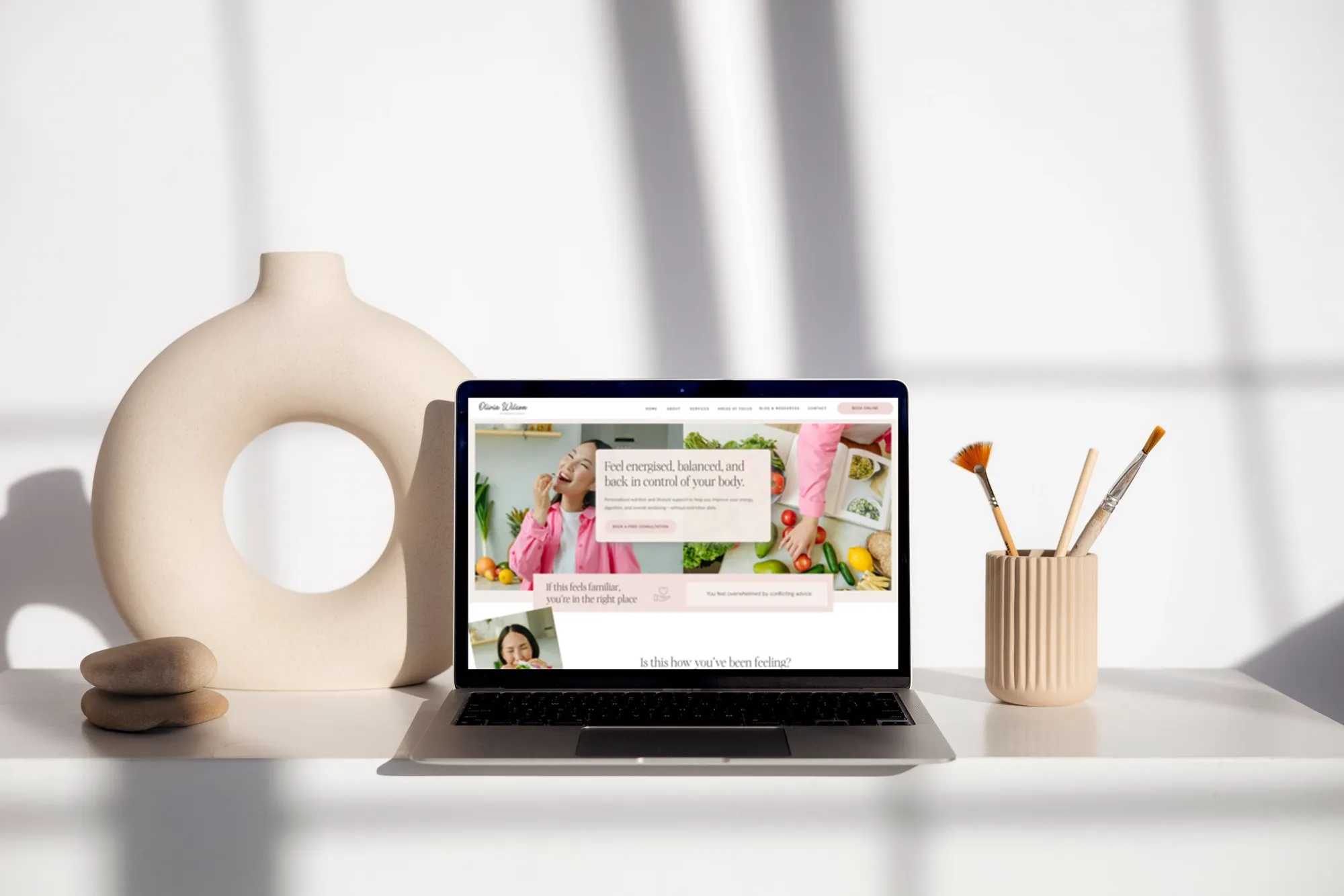 The Olivia Wilson website template on a laptop