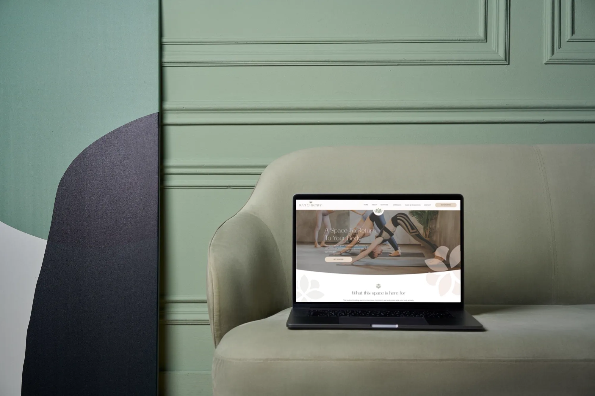 The Root & Breathe website template on a laptop