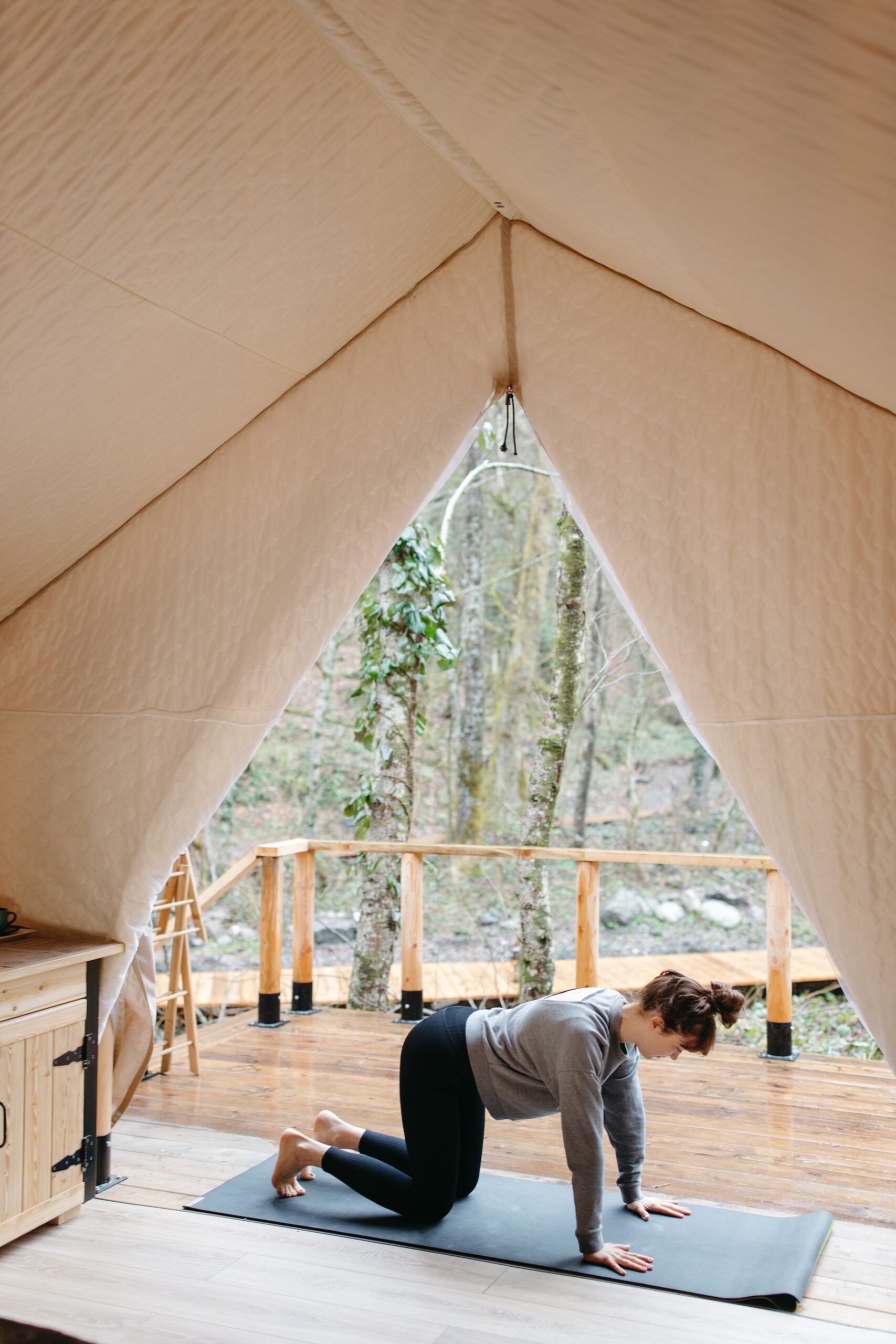 Stretching in a canopy studio