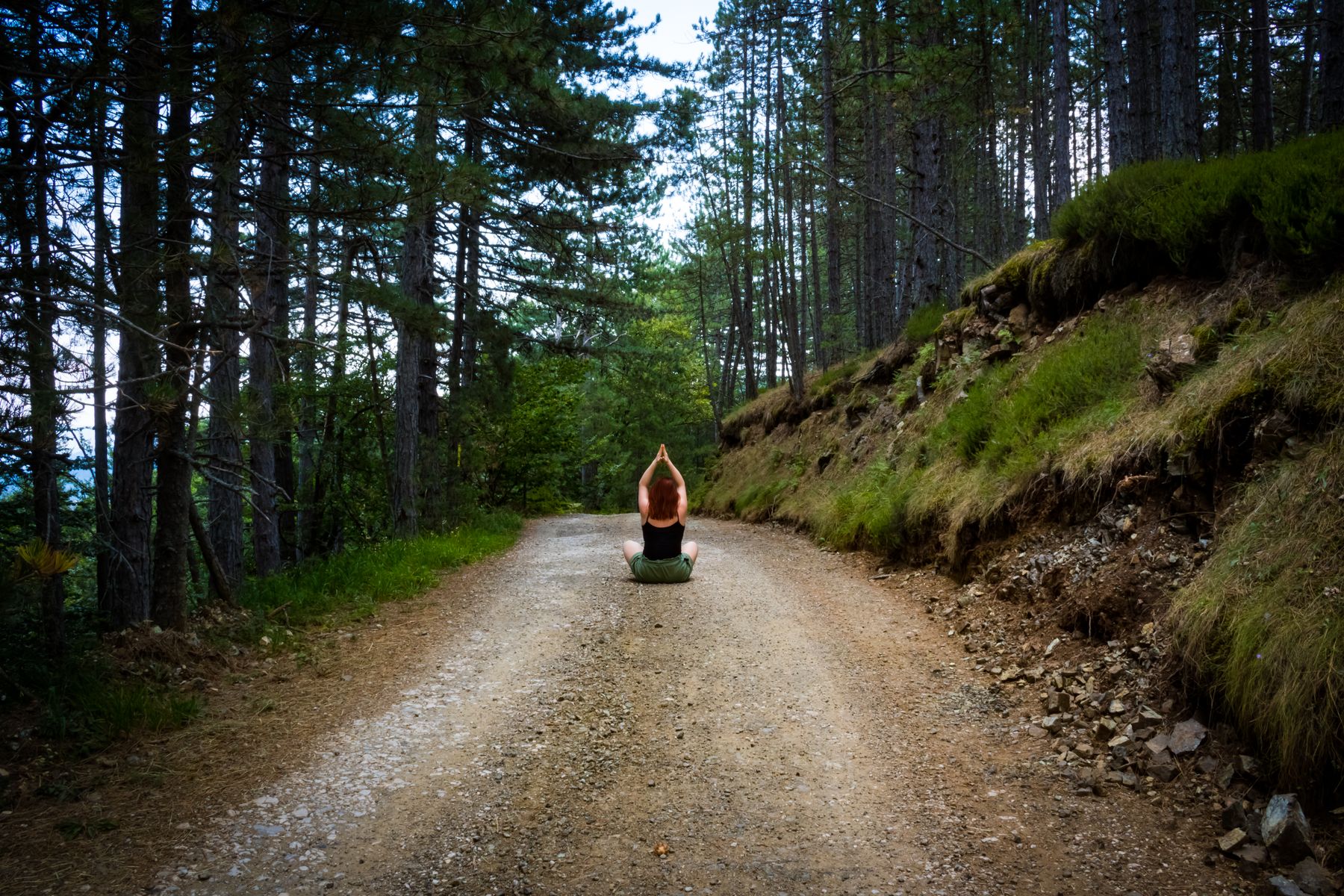 Meditating on a forest path