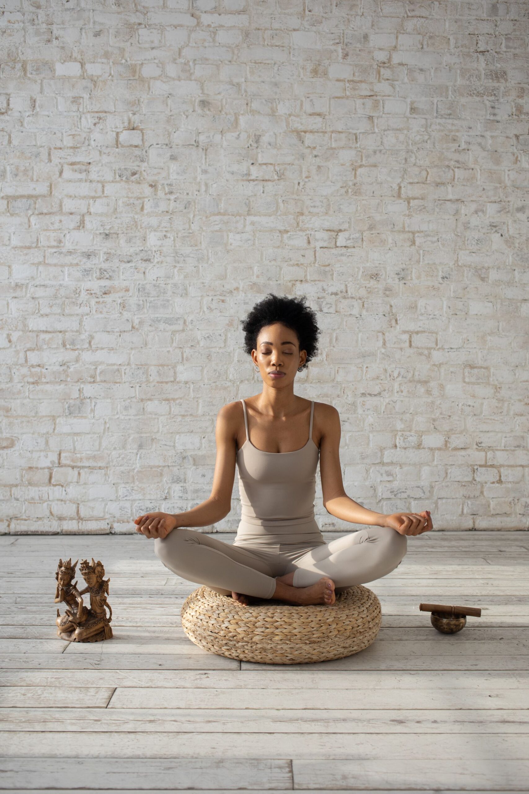 Woman meditating on a cushion