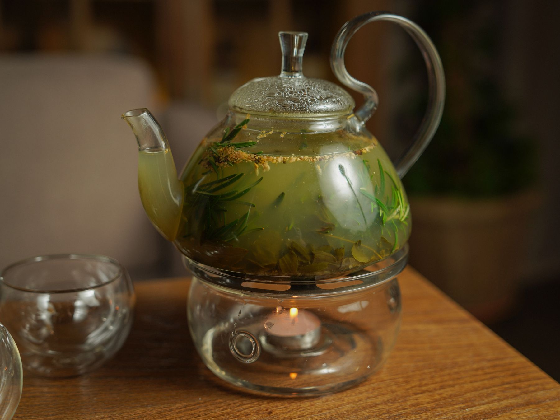 Teapot warmed by a candle