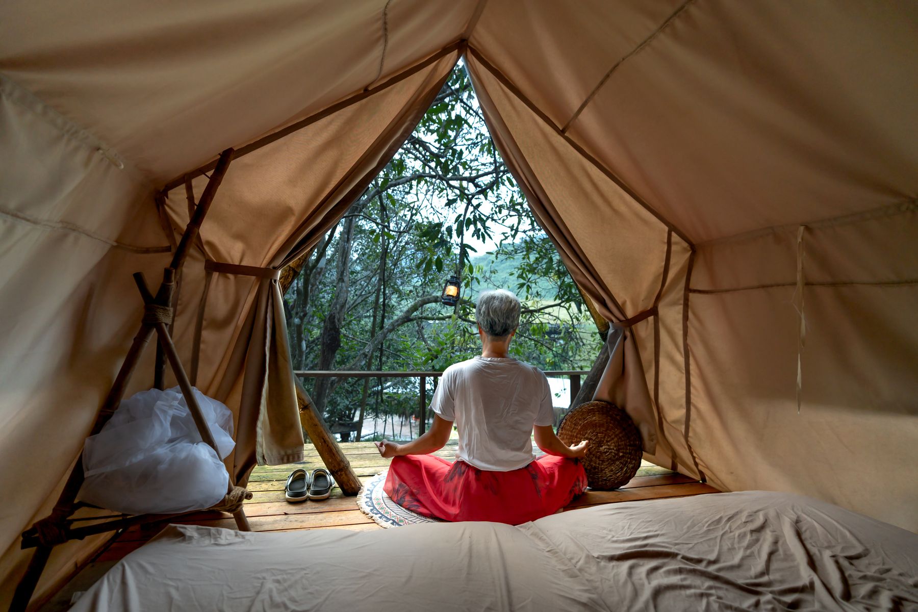 Meditating in a retreat tent